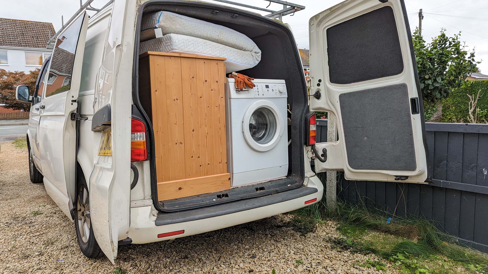 White van packed with furniture for transportation